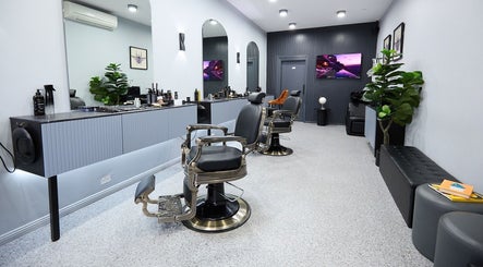 Modern interior of Homme Grooming, Naremburn, New South Wales, AU, featuring stylish barber chairs and decor.