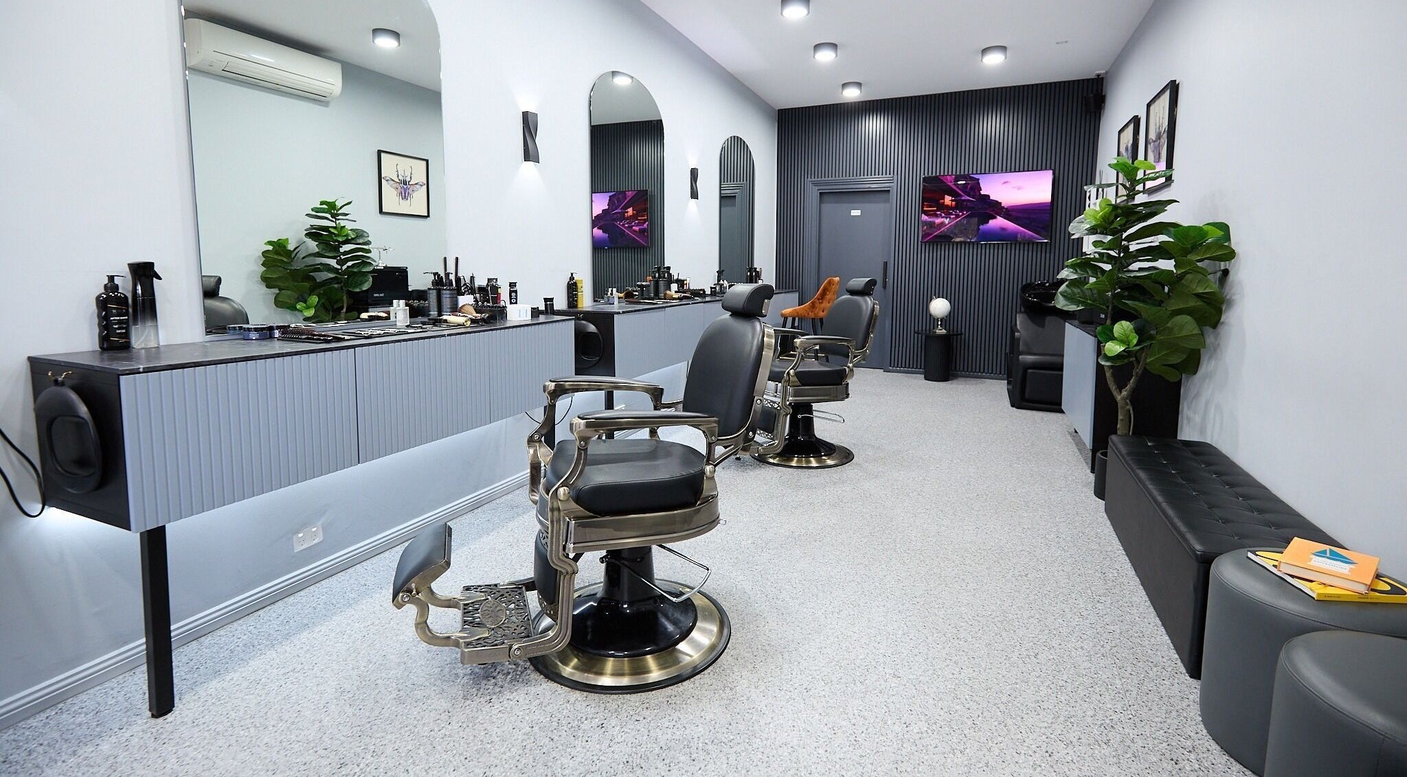 Modern interior of Homme Grooming in Naremburn, New South Wales, AU, featuring stylish barber chairs and decor.