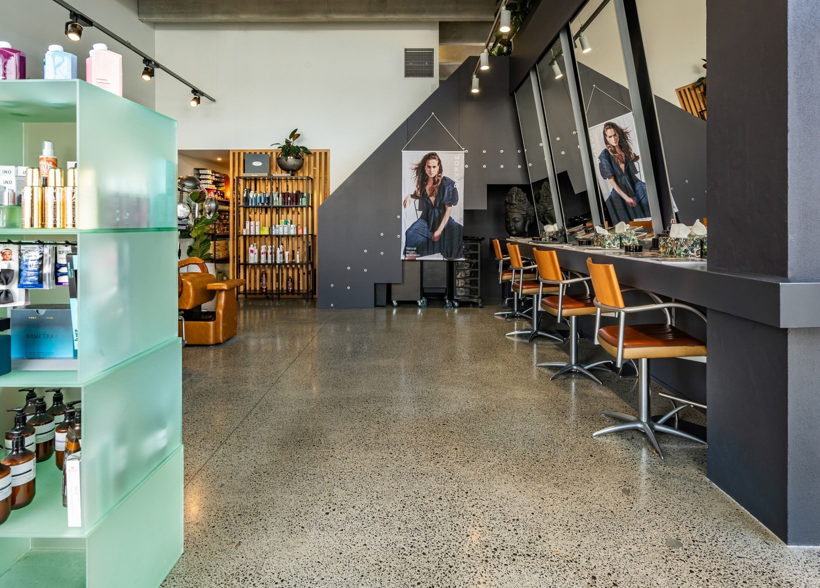 Modern salon interior at The Colour Bar, Auckland, Auckland, NZ, featuring stylish decor and beauty products.