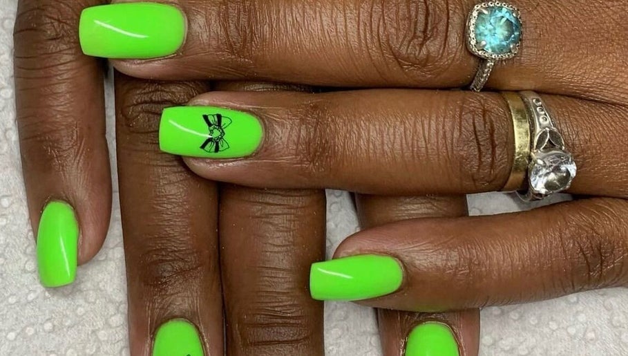 Bright neon green nails with bow art at Rue’s_beauty_studio, Cape Town, Western Cape, ZA