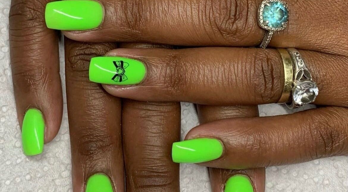 Bright neon green nails with bow art at Rue’s_beauty_studio, Cape Town, Western Cape, ZA