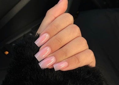 Stylish pink manicure at Rue’s_beauty_studio in Cape Town, Western Cape, ZA, showcasing nail art expertise.