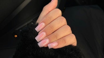 Stylish pink manicure at Rue’s_beauty_studio in Cape Town, Western Cape, ZA, showcasing nail art expertise.