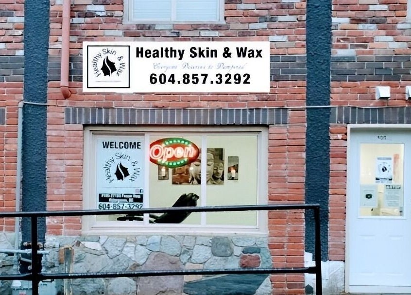 Exterior of Healthy Skin and Wax in Langley Township, British Columbia, showcasing welcome and open signs.
