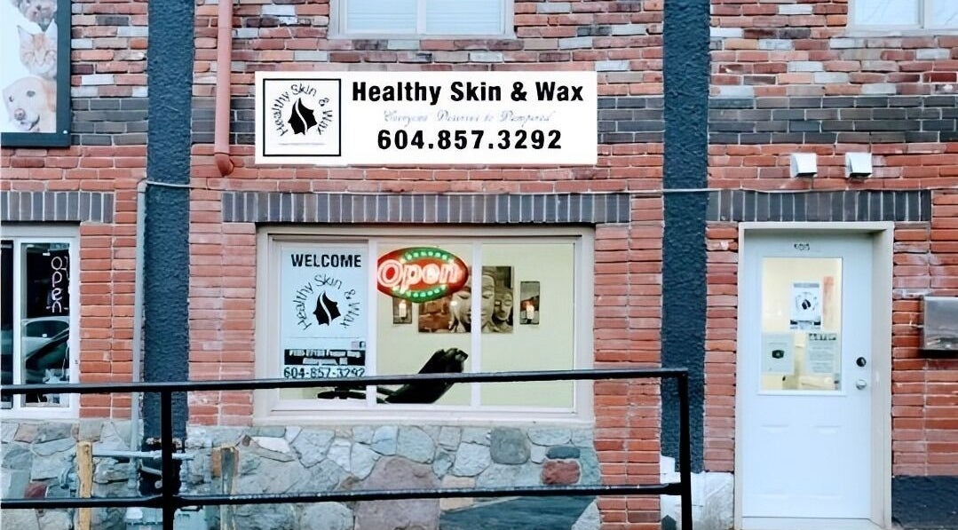 Exterior of Healthy Skin and Wax in Langley Township, British Columbia, showcasing welcome and open signs.