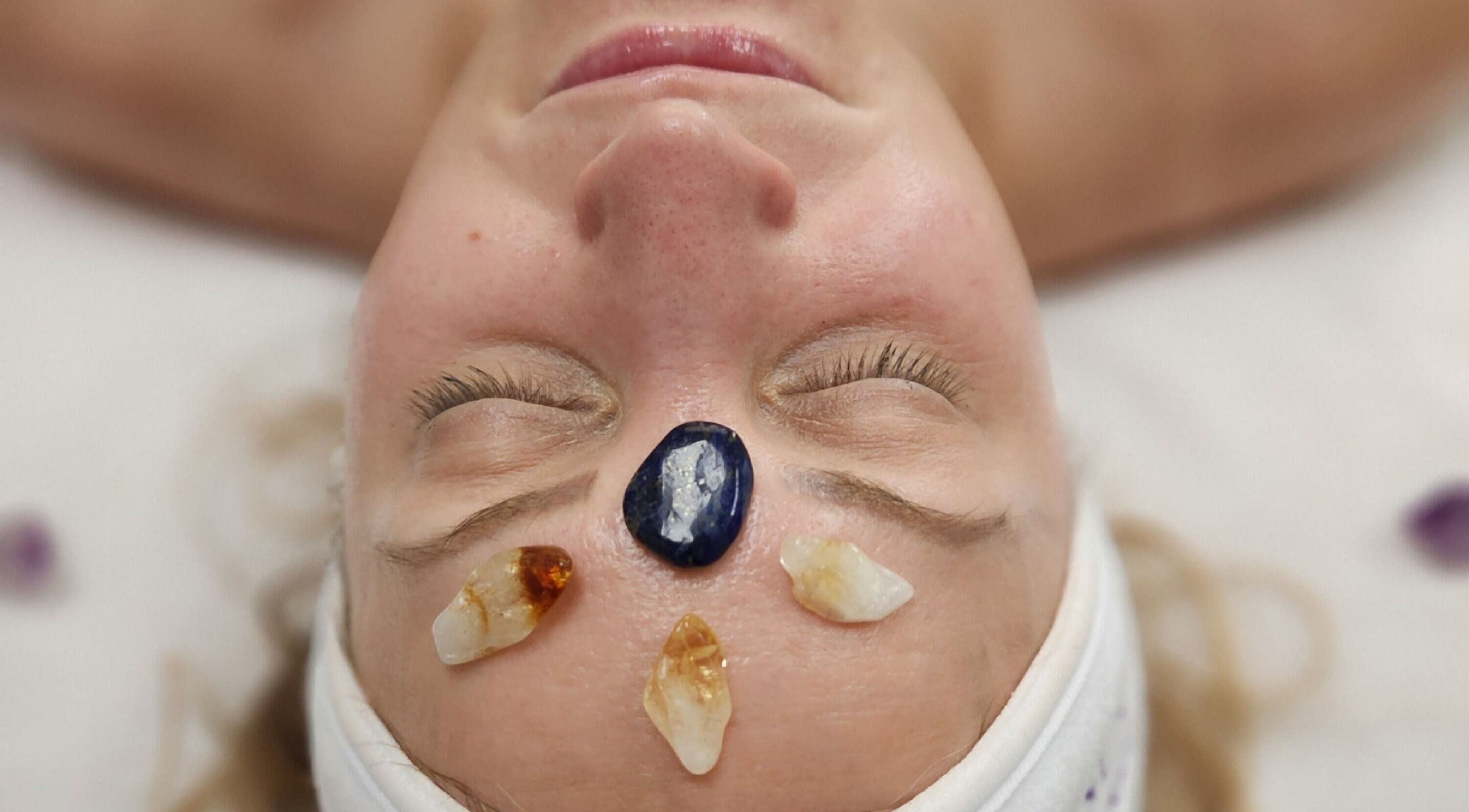 Facial with healing crystals at Enlightened Esthetics, Woodstock, Georgia, US.