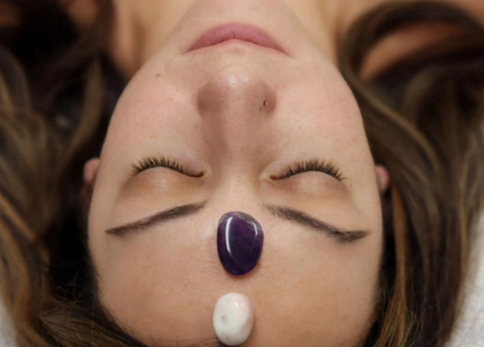 Relaxing crystal facial treatment at Enlightened Esthetics in Woodstock, Georgia, US enhances calm and wellness.