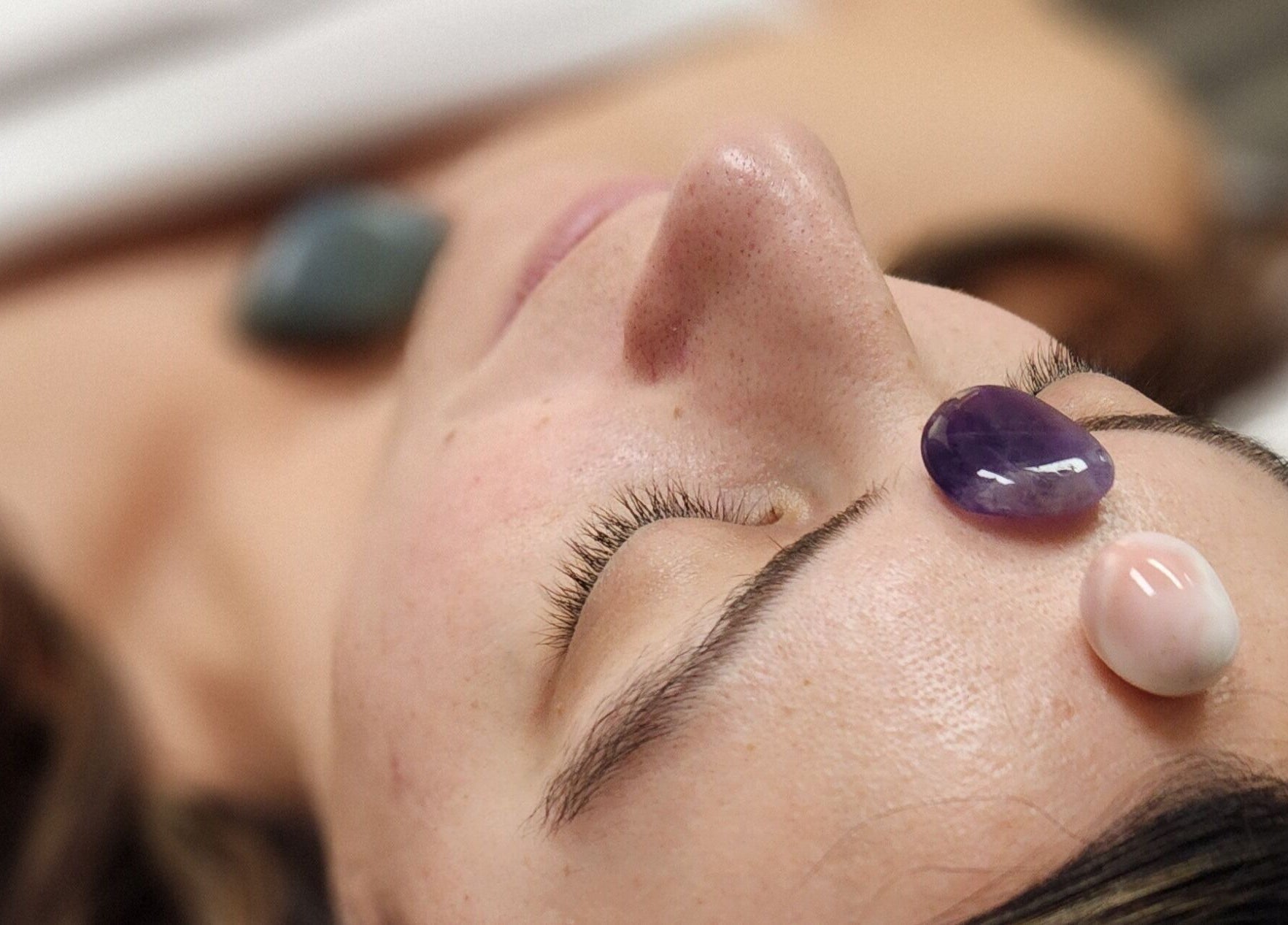 Close-up of crystal facial therapy at Enlightened Esthetics, Woodstock, Georgia, US.