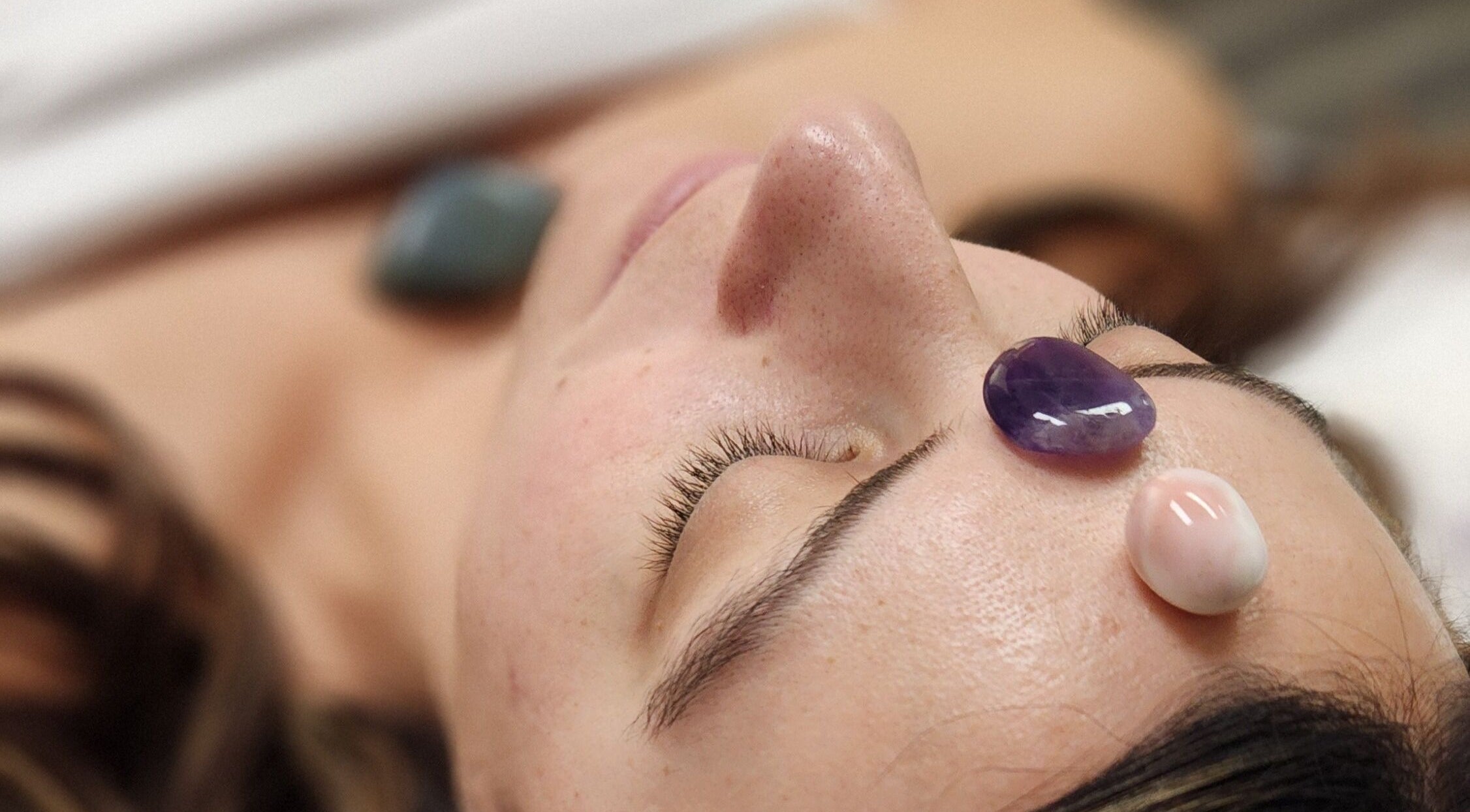 Close-up of crystal facial therapy at Enlightened Esthetics, Woodstock, Georgia, US.