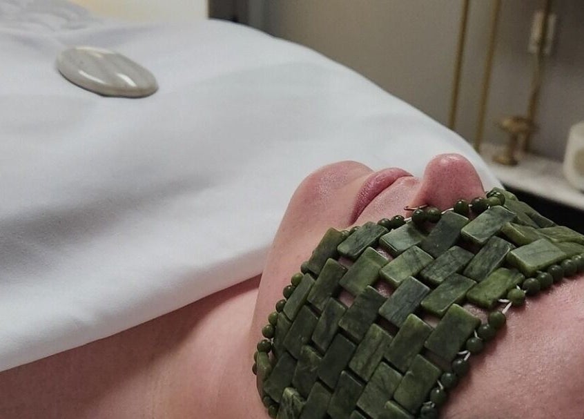 Rejuvenating jade facial at Enlightened Esthetics, Woodstock, Georgia, US, promoting relaxation and wellness.