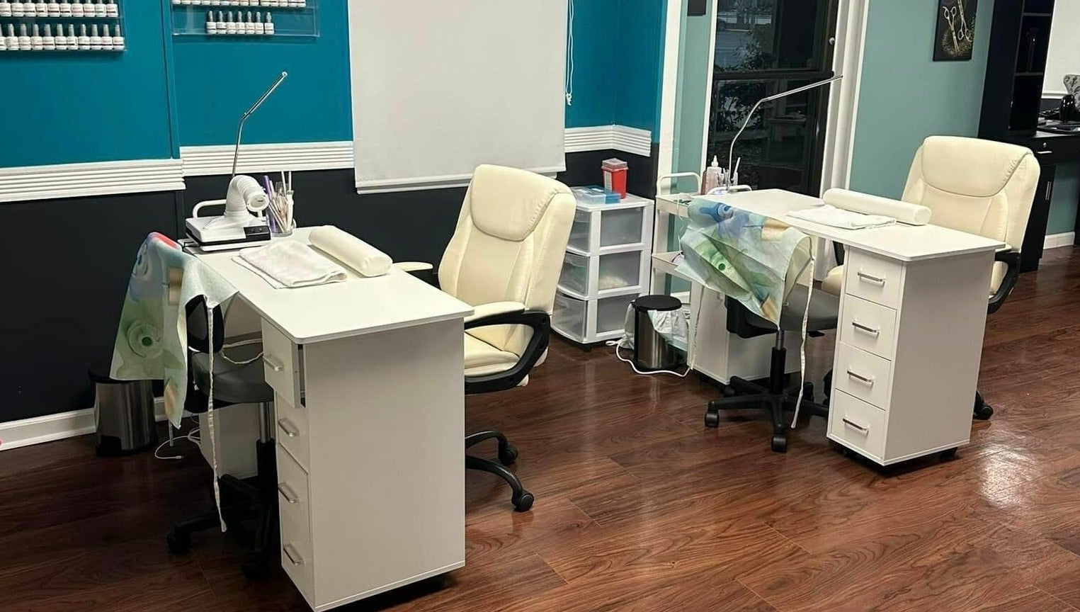 Chic nail stations at Glitteratti Salón Florida in Ormond Beach, Florida, US showcasing modern decor.