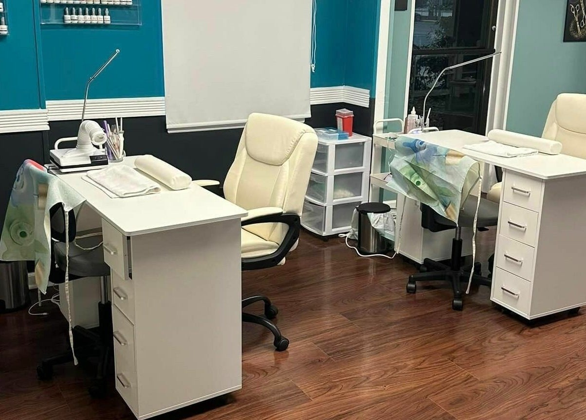 Chic nail stations at Glitteratti Salón Florida in Ormond Beach, Florida, US showcasing modern decor.