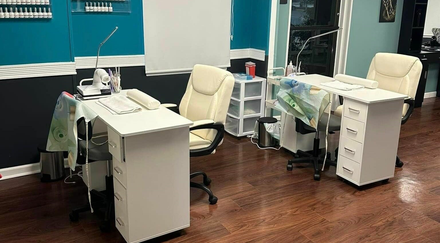 Chic nail stations at Glitteratti Salón Florida in Ormond Beach, Florida, US showcasing modern decor.