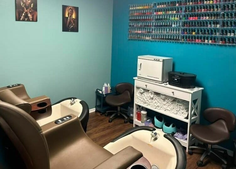 Nail salon chairs and polish wall display at Glitteratti Salón Florida, Ormond Beach, Florida, US.