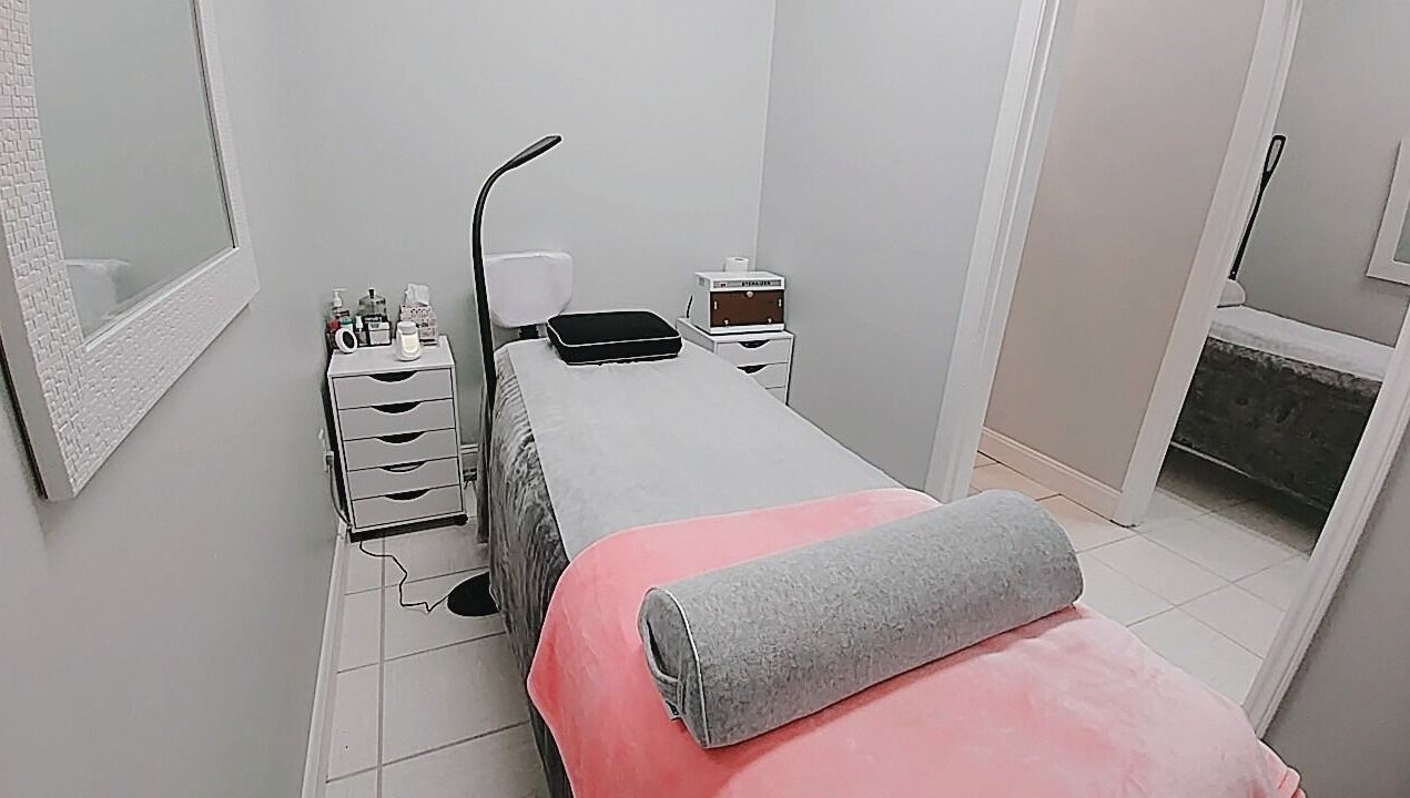 Tranquil treatment room at iBeauty Studio in Raleigh, North Carolina, US with a cozy massage table.