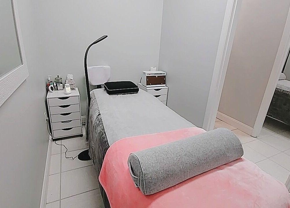 Tranquil treatment room at iBeauty Studio in Raleigh, North Carolina, US with a cozy massage table.