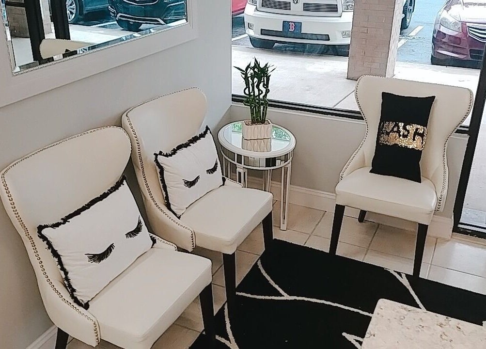 Stylish seating at iBeauty Studio in Raleigh, North Carolina, US featuring elegant chairs and modern decor.