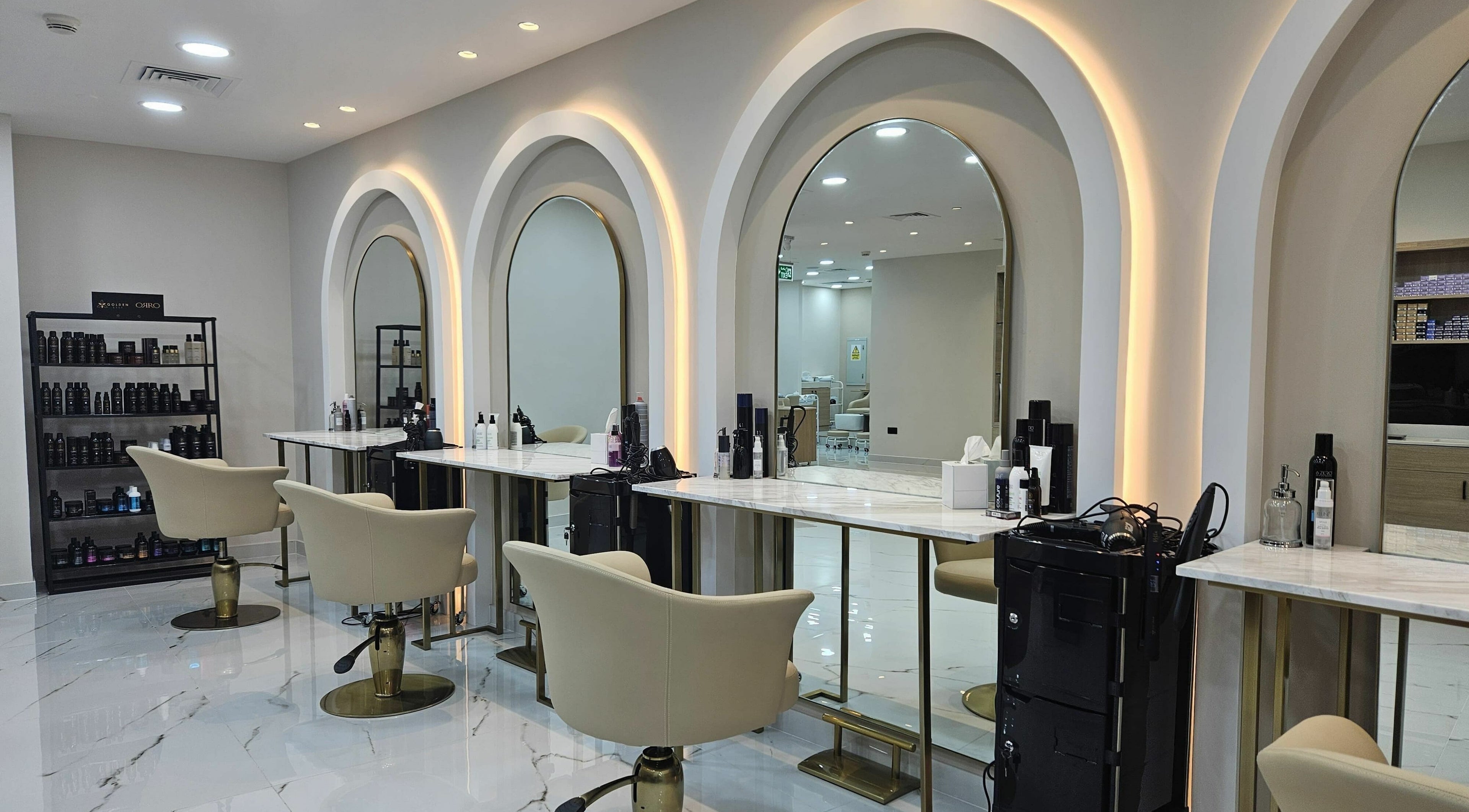 Elegant salon interior at Barbella by Blue Tree, Dubai, Dubai, AE with stylish chairs and mirrors.