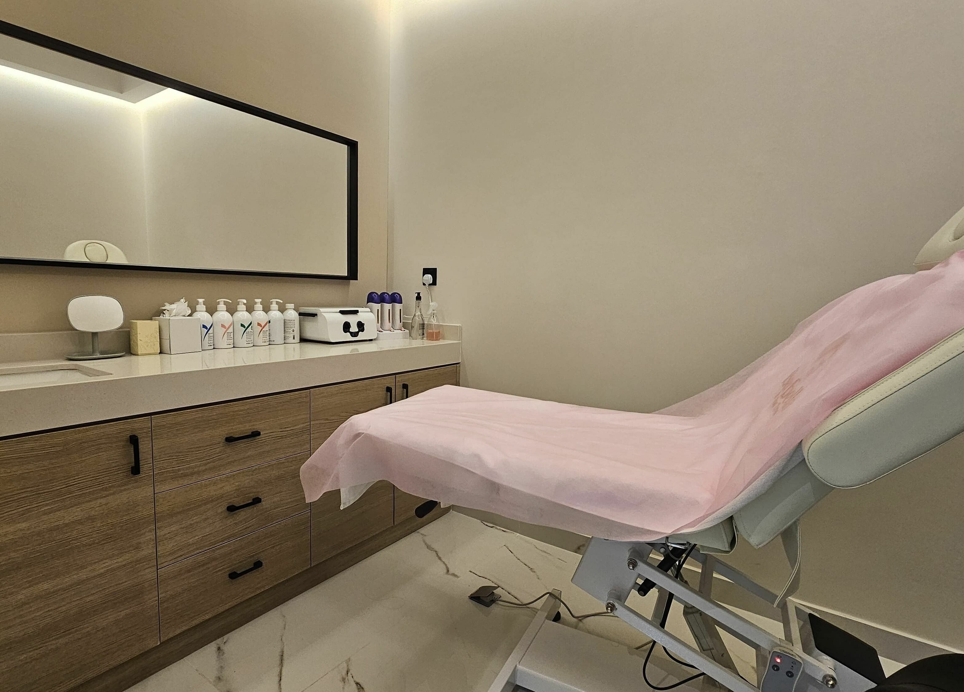 Relaxing treatment room at Barbella by Blue Tree, Dubai, Dubai, AE, featuring a treatment bed and modern decor.