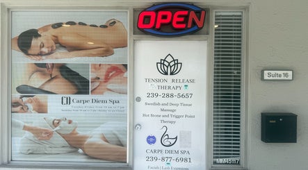Tension Release Therapy – Massage in Fort Myers, FL entrance shows services list and welcoming open sign.
