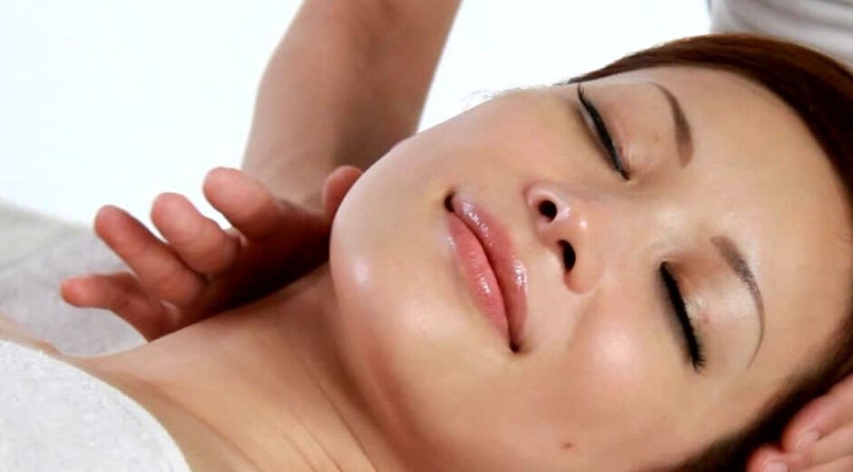 Relaxed woman receiving massage at Tension Release Therapy – Massage in Fort Myers, FL. Address: Fort Myers, Florida, US.