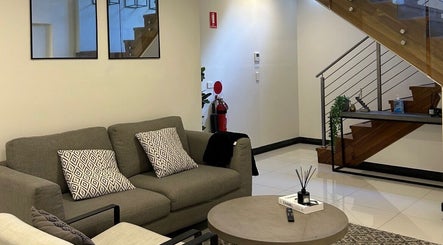 Stylish lounge area with modern decor at Derma Corner, Parramatta, New South Wales, AU.