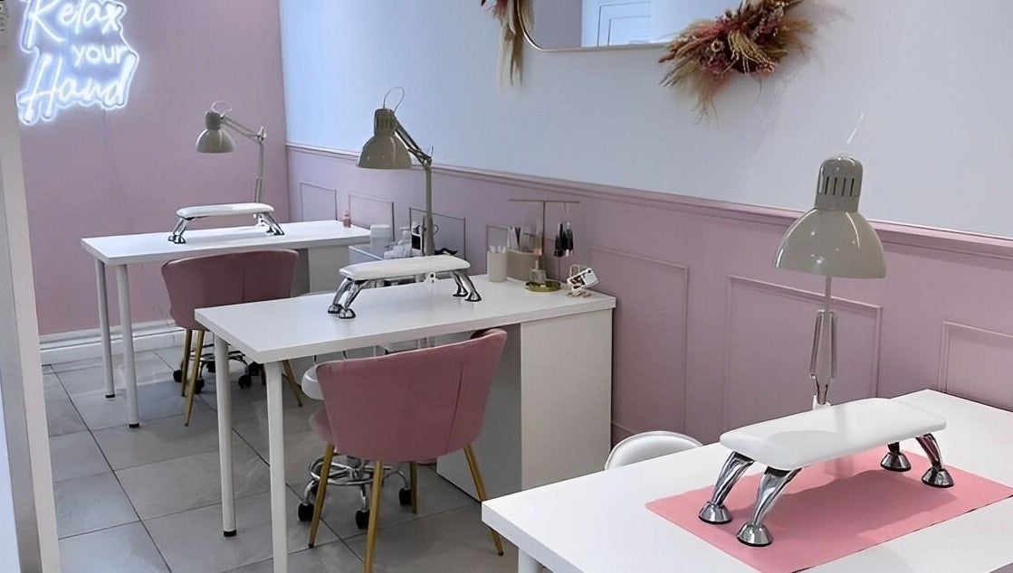 Chic nail stations at LoFlo Nails, Shrewsbury, England, GB with pink accents and modern decor.