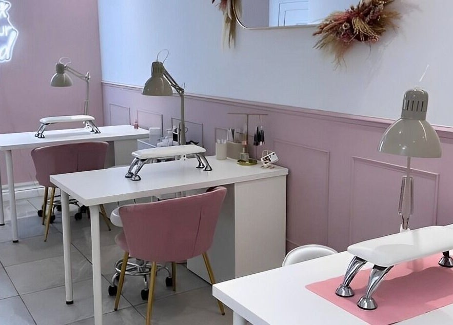 Chic nail stations at LoFlo Nails, Shrewsbury, England, GB with pink accents and modern decor.
