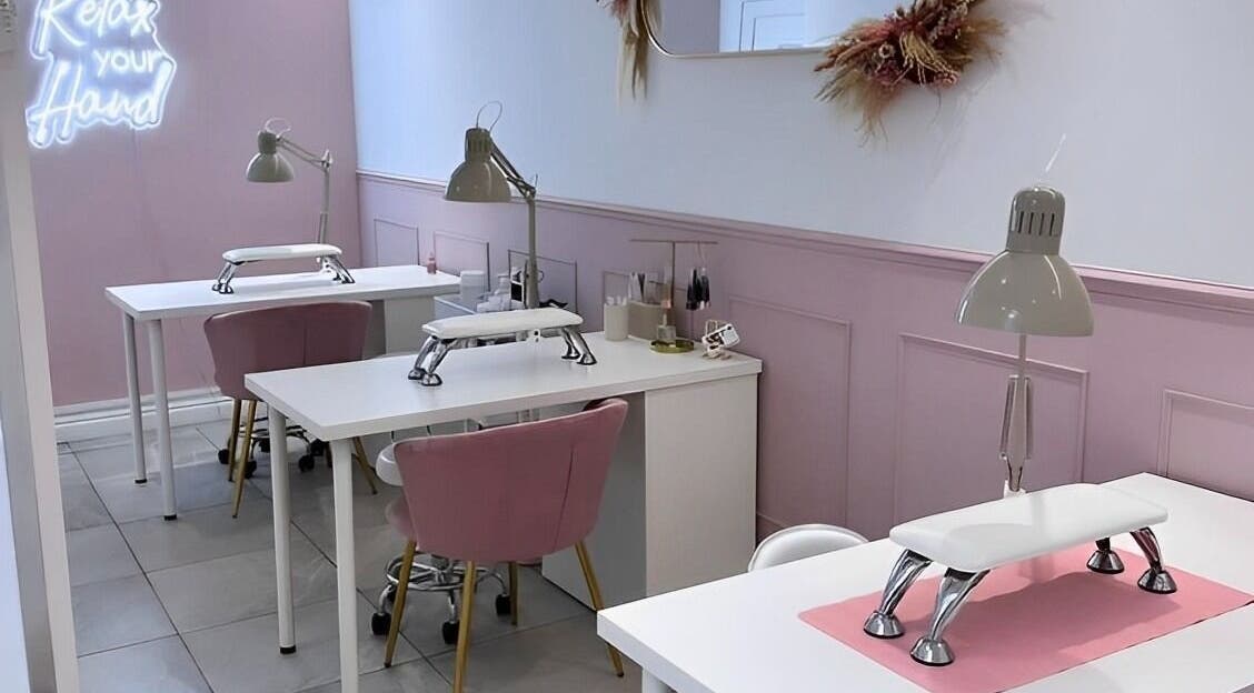 Chic nail stations at LoFlo Nails, Shrewsbury, England, GB with pink accents and modern decor.