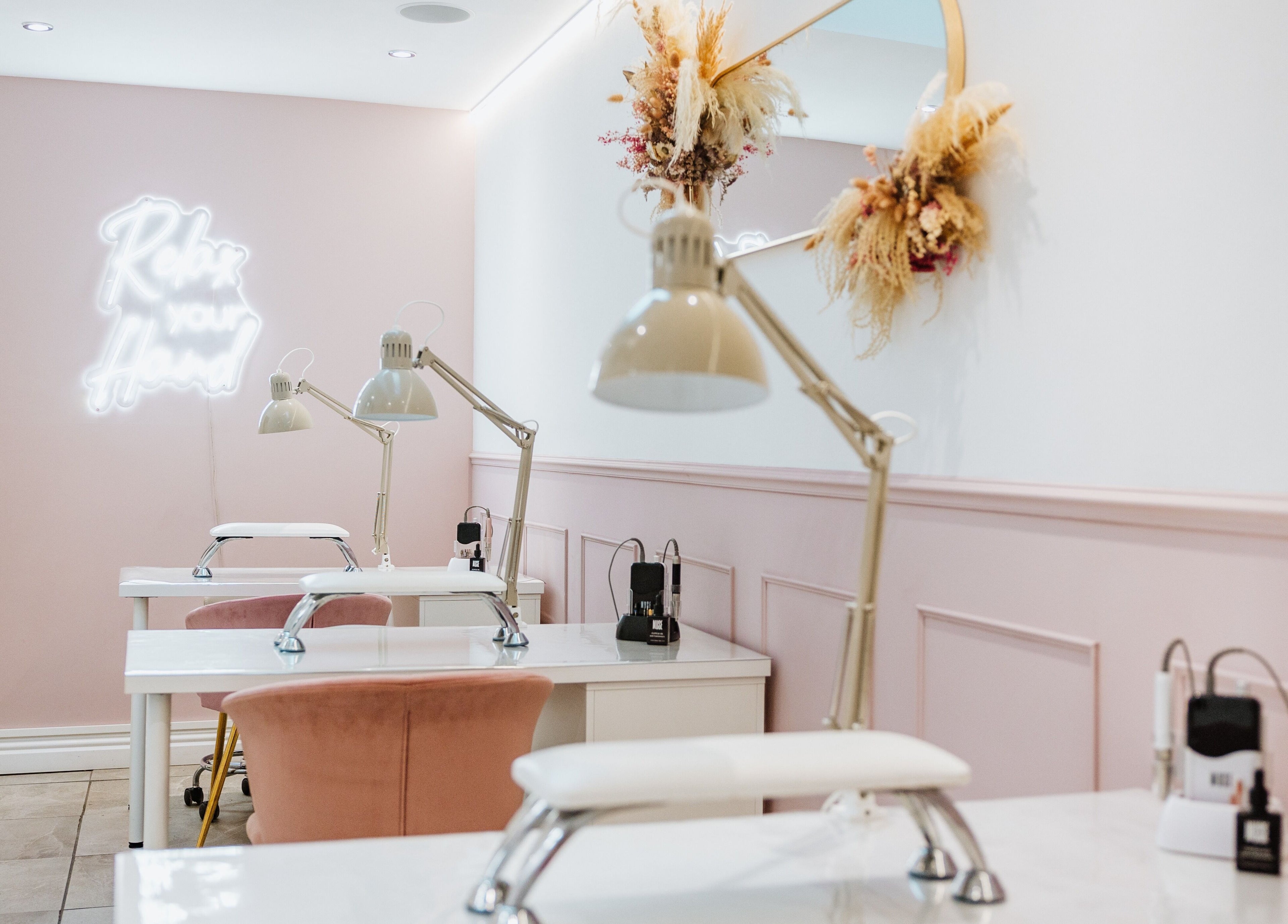 Elegant interior of LoFlo Nails in Shrewsbury, England, GB showcasing modern nail workstations.