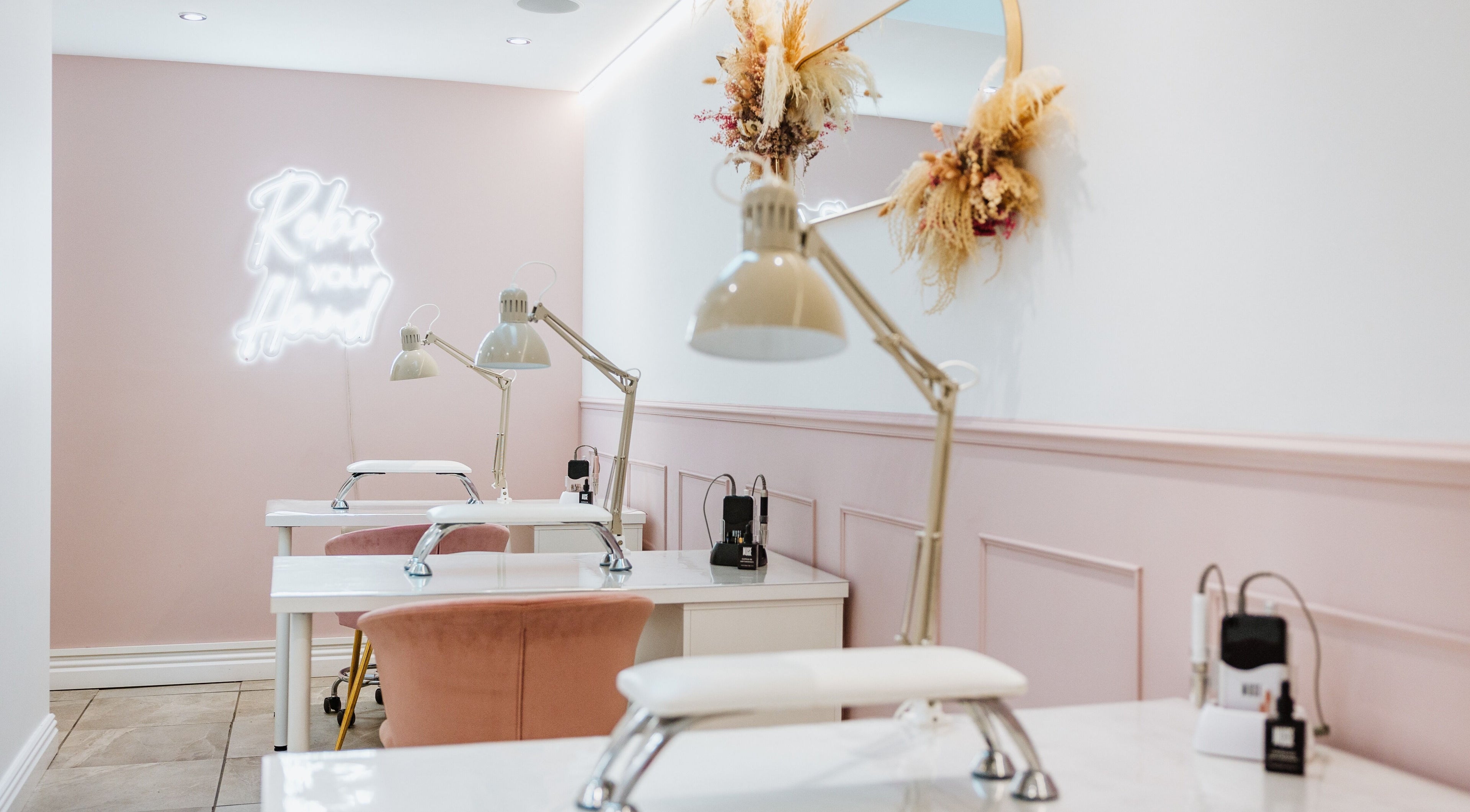 Elegant interior of LoFlo Nails in Shrewsbury, England, GB showcasing modern nail workstations.