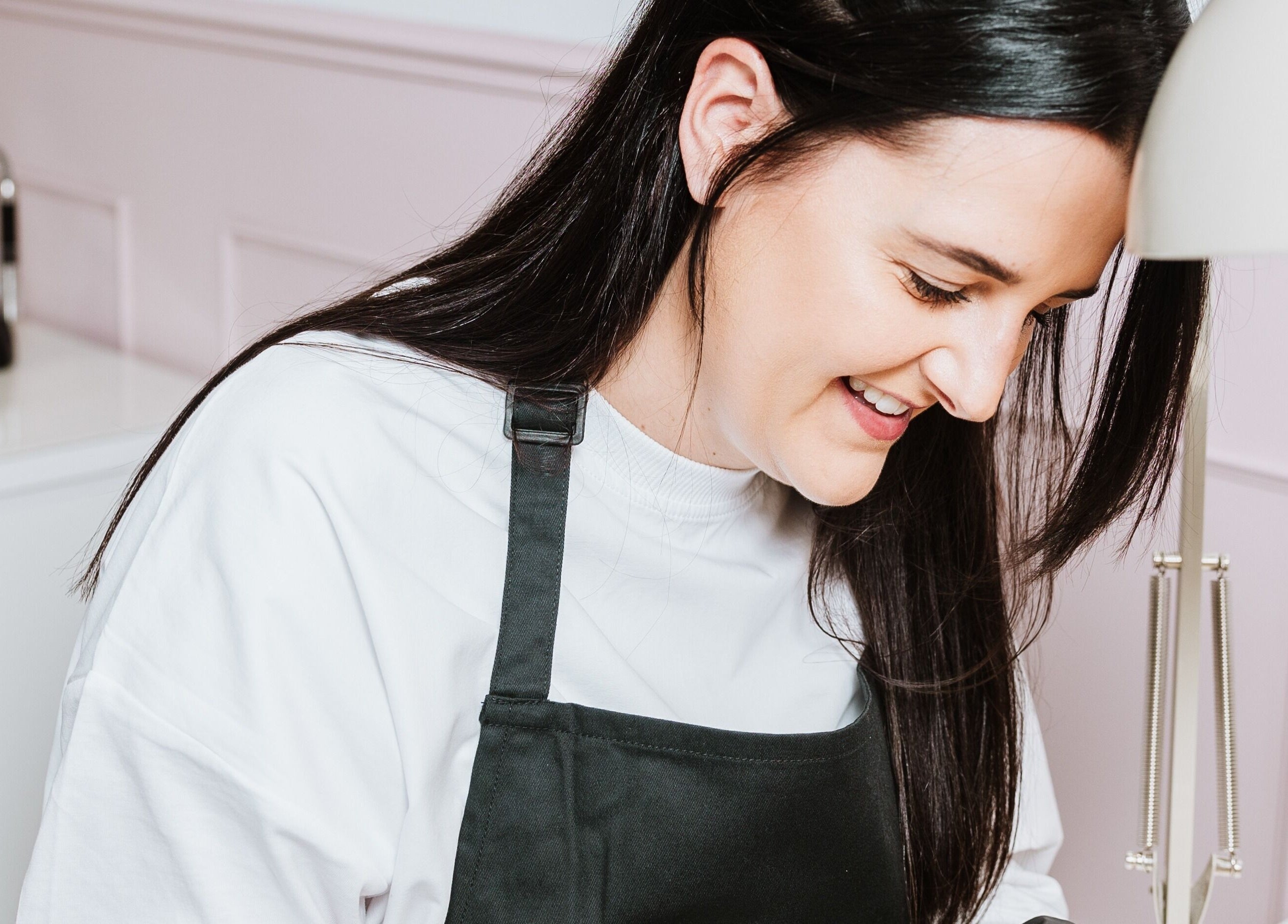 Nail artist at LoFlo Nails in Shrewsbury, England crafting a manicure with precision.