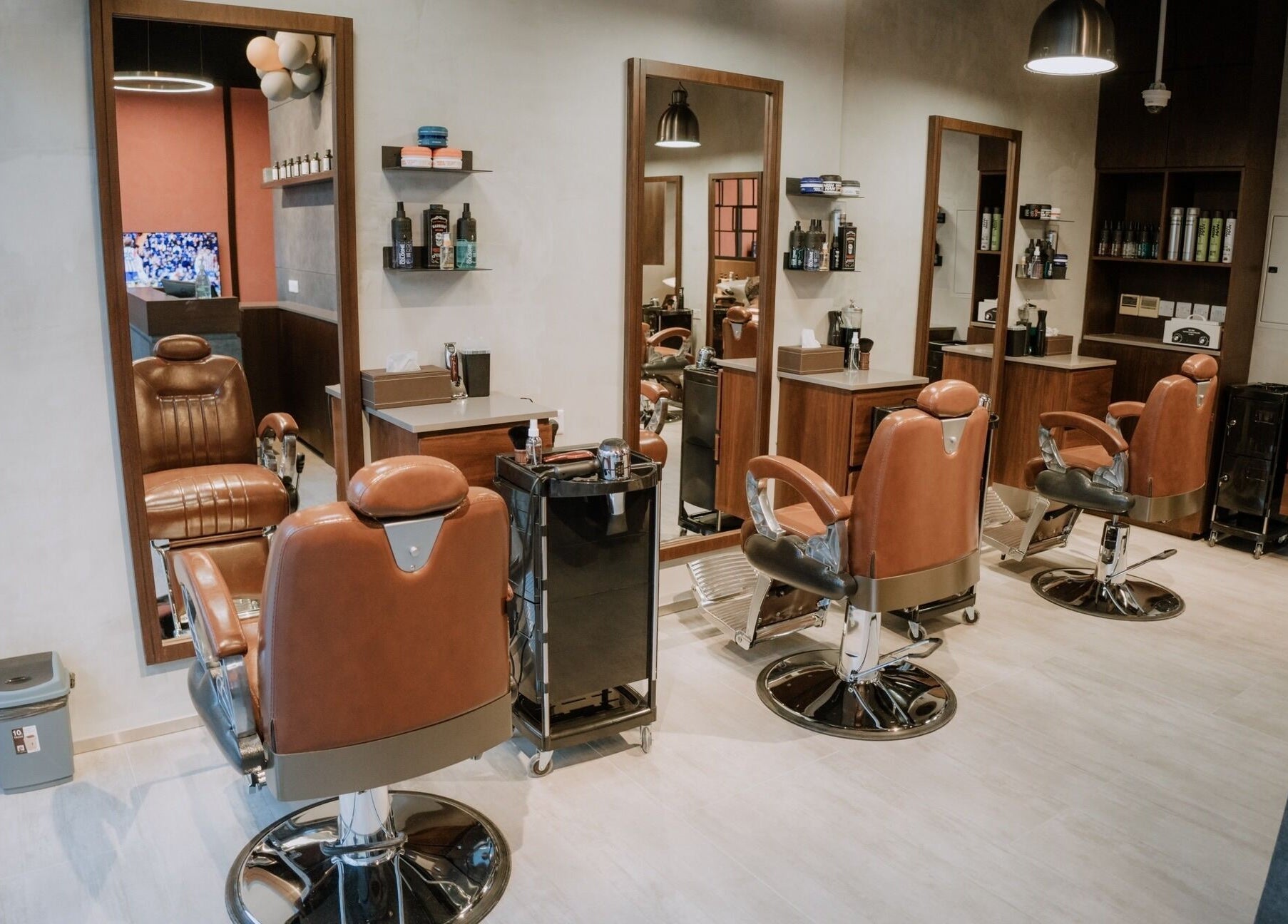 Interior of Upgrade Barbershop JVC featuring elegant leather chairs in دبي, دبي, AE.