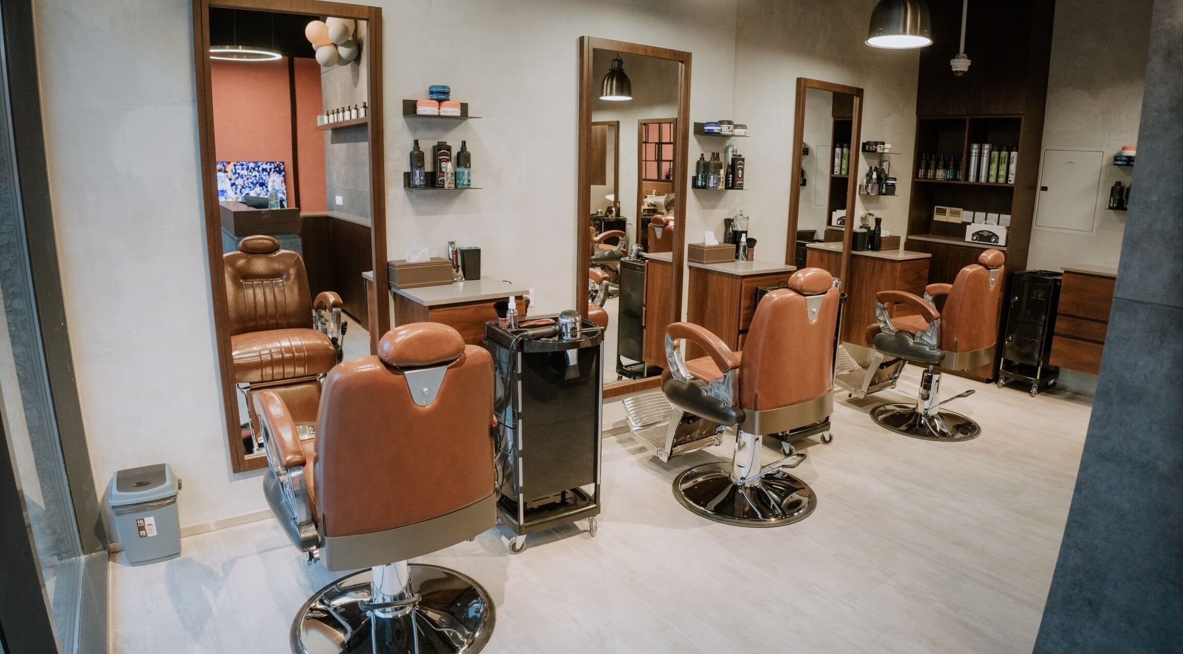 Interior of Upgrade Barbershop JVC featuring elegant leather chairs in دبي, دبي, AE.