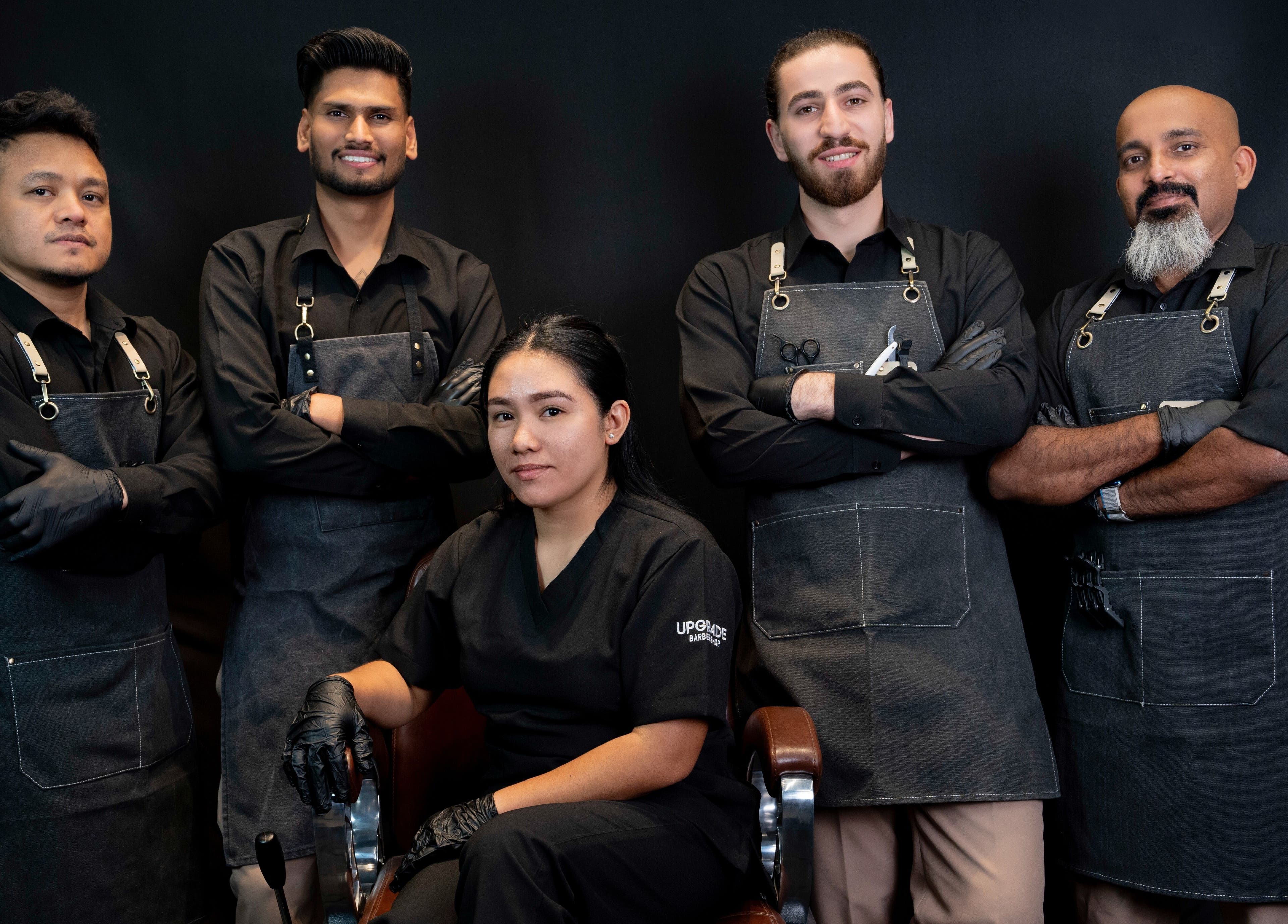 Professional team at Upgrade Barbershop JVC, Dubai, AE, showcasing expertise and friendly service.