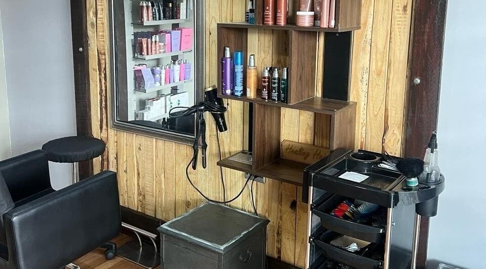 Cozy salon corner at Hairgicians PE, Port Elizabeth, South Africa, ZA with products and modern styling tools.