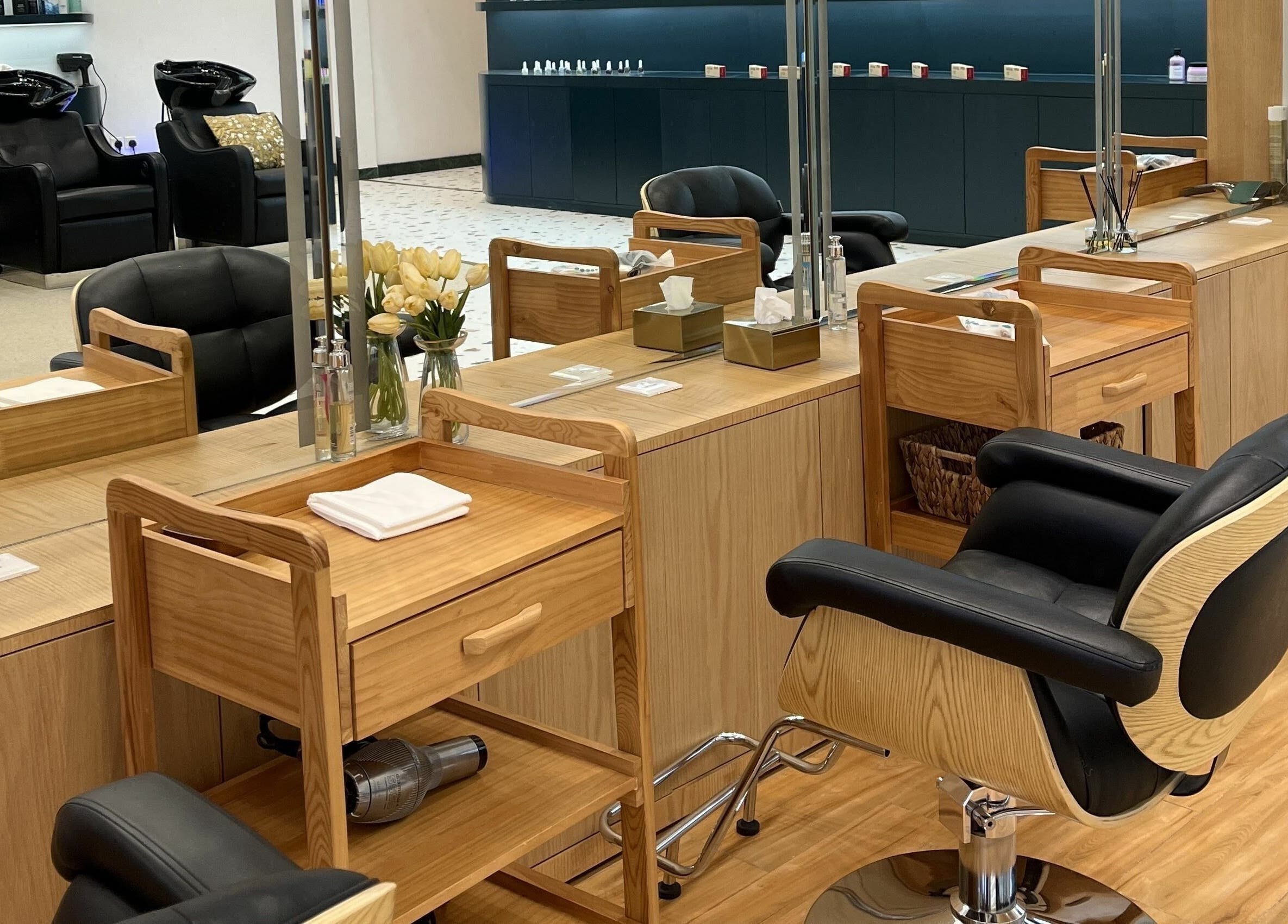 Luxurious interior of Jeunesse Salon | صالون جونيس in Riyadh, Riyadh Province, SA featuring chic styling stations.