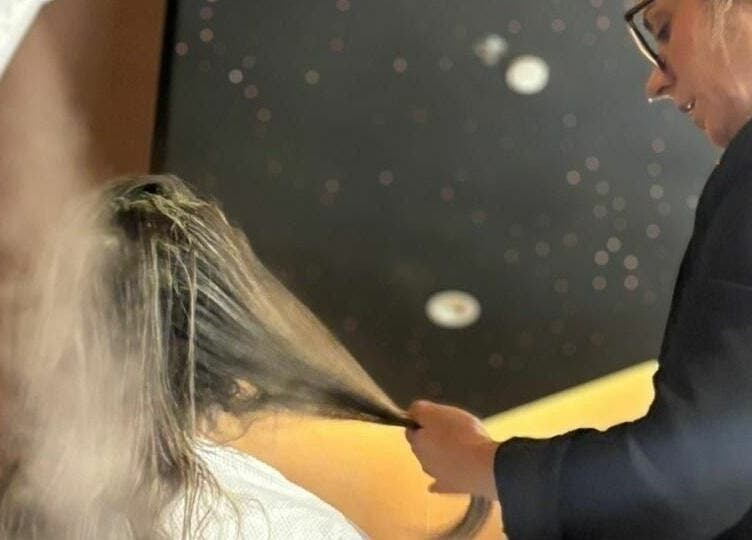 Professional hairstylist at Jeunesse Salon | صالون جونيس in Riyadh, Riyadh Province, SA giving a luxurious hair treatment.