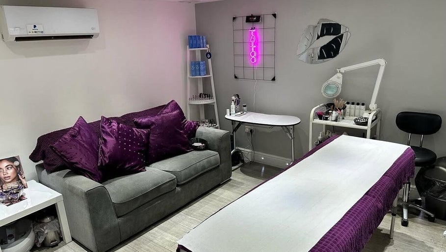 Cozy treatment room at Dawn Donovan Beauty & Aesthetics, village, England, GB, with plush purple accents.