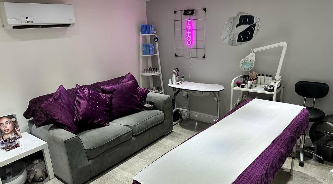 Cozy treatment room at Dawn Donovan Beauty & Aesthetics, village, England, GB, with plush purple accents.
