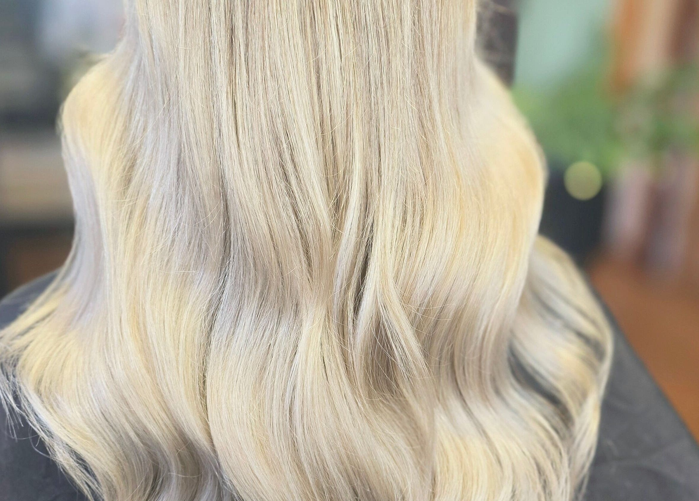 Silky blonde hair styled at Unique Hair Design, Nelson, Nelson, NZ for a smooth, lustrous finish.