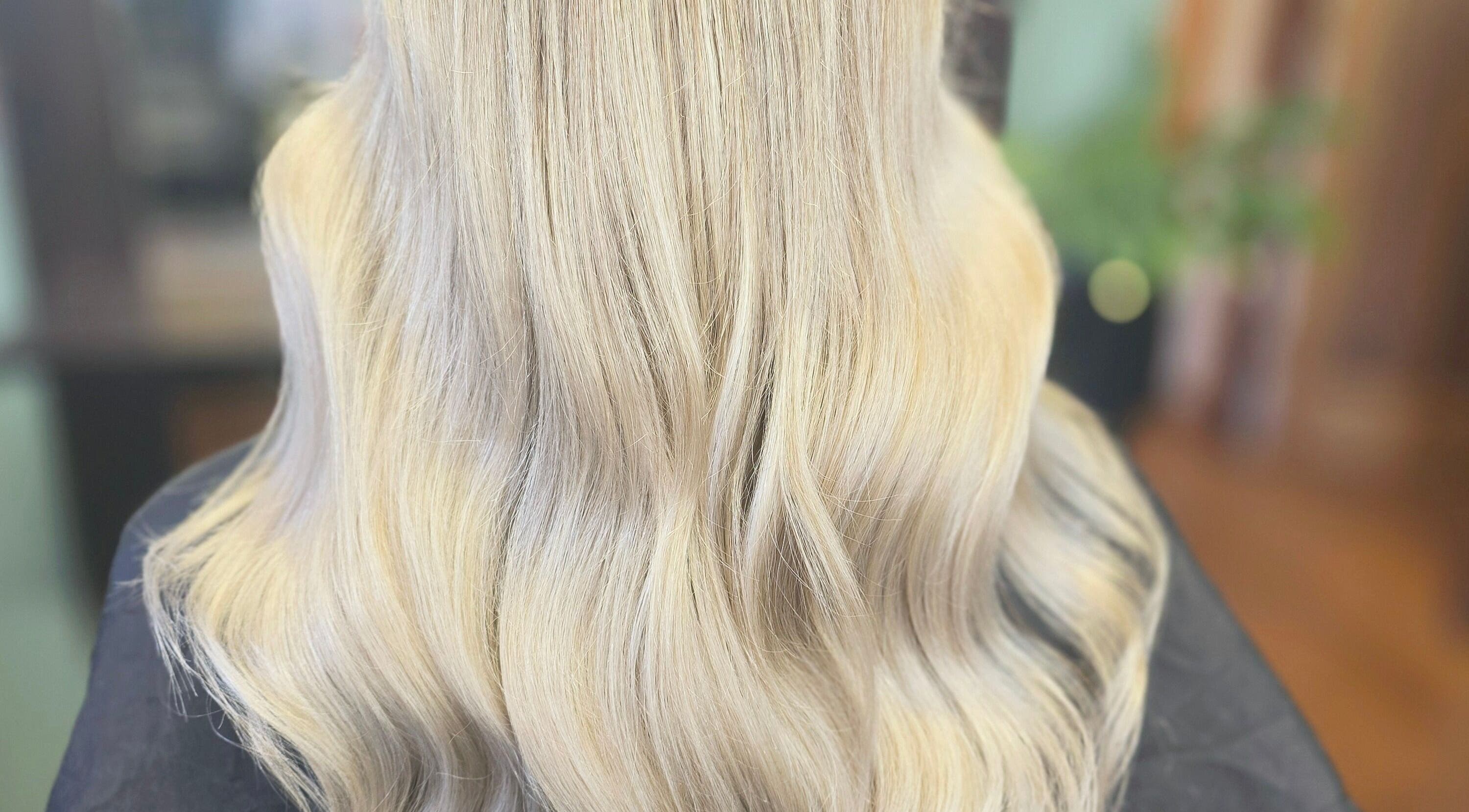 Silky blonde hair styled at Unique Hair Design, Nelson, Nelson, NZ for a smooth, lustrous finish.