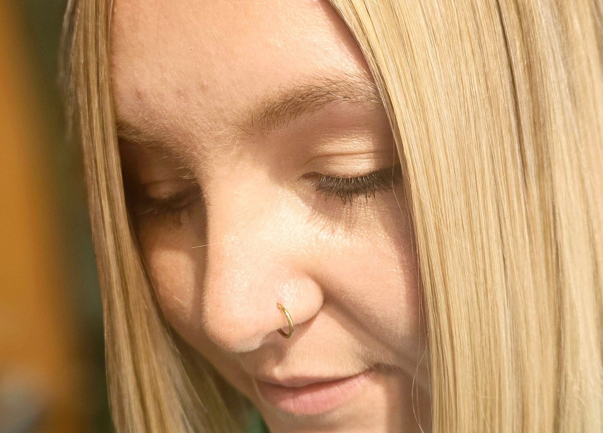 Close-up of sleek, blonde hair at Unique Hair Design, Nelson, Nelson, NZ.