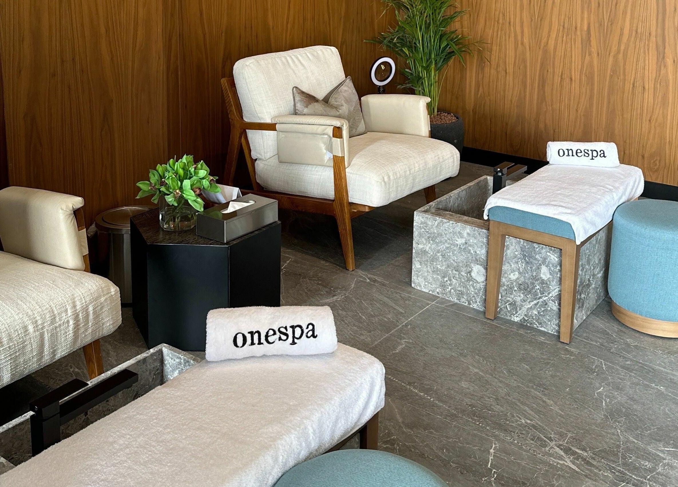 Relaxing lounge at One Spa, Riyadh, featuring cozy seating and calming decor.