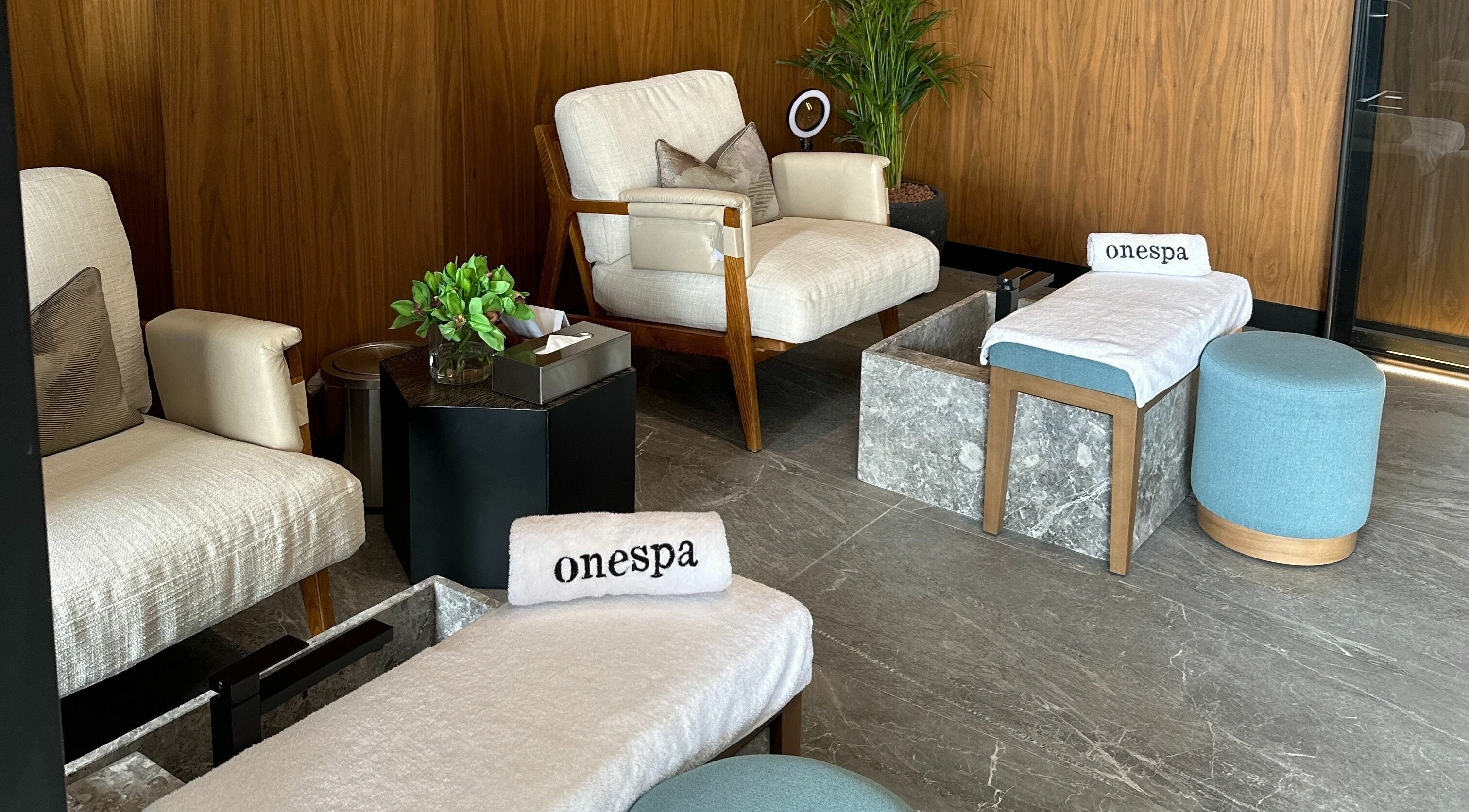 Relaxing lounge at One Spa, Riyadh, featuring cozy seating and calming decor.