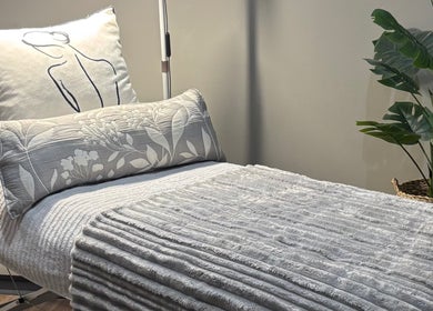 Relaxing treatment bed with elegant pillows at Rosy Touch Aesthetics Ceres, Ceres, Western Cape, ZA.