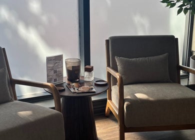 Relaxing lounge at Rosy Touch Aesthetics Ceres, Ceres, Western Cape, ZA, with plush chairs and ambient light.