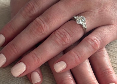 Close-up of elegant manicured hands with a diamond ring at Rosy Touch Aesthetics Ceres, Ceres, Western Cape, ZA.