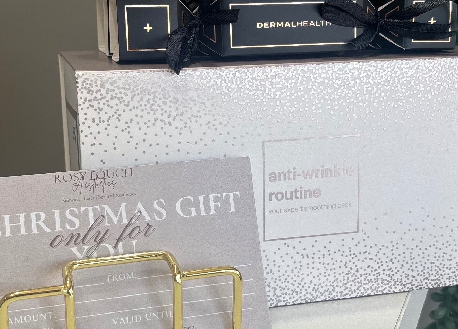 Elegant RosyTouch Aesthetics Ceres gift voucher displayed with anti-wrinkle set in Ceres, Western Cape, ZA.