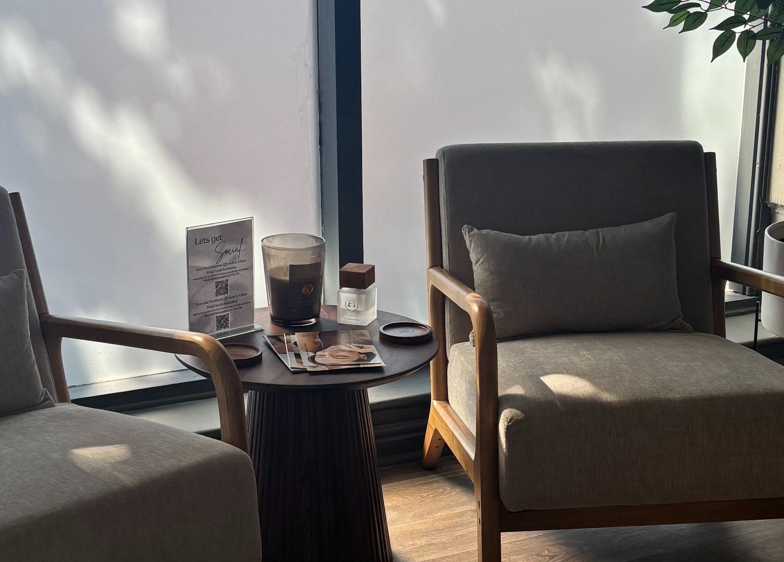 Relaxing seating area at RosyTouch Aesthetics Ceres, Ceres, Western Cape, ZA, with soft lighting and decor.